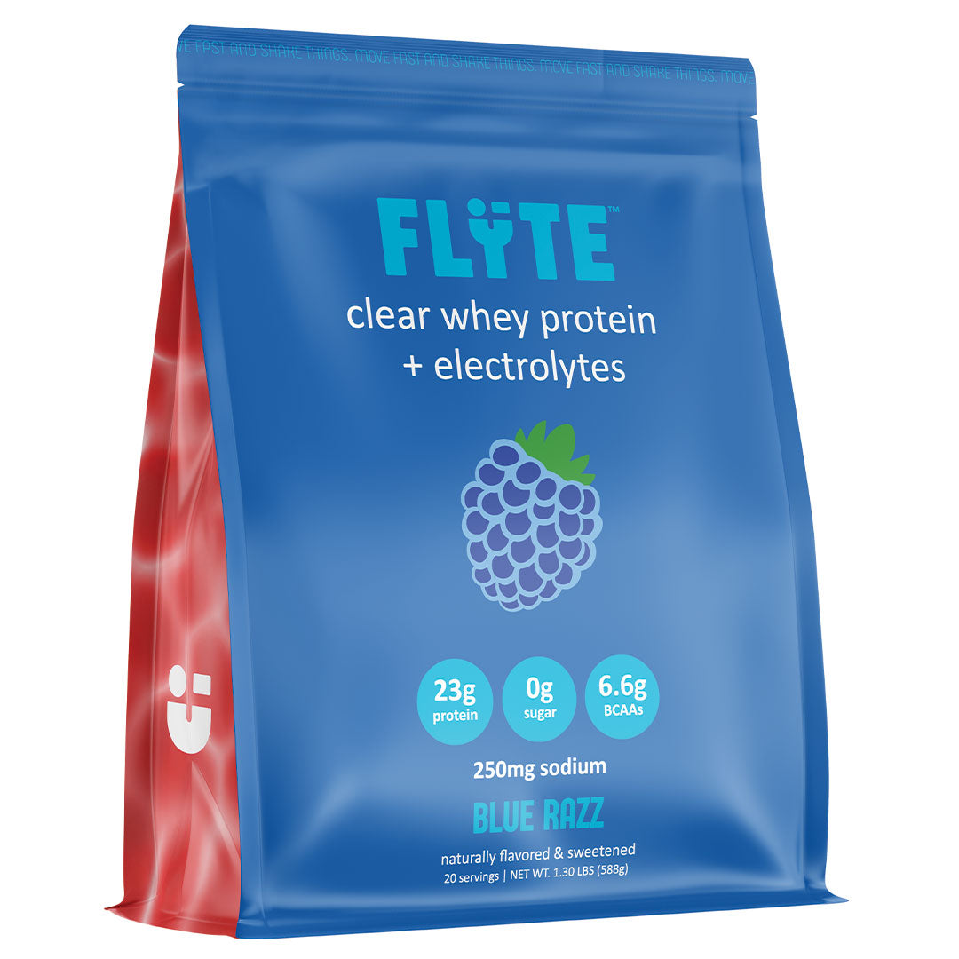 FLYTE Protein Blue Razz clear whey isolate — drinks light and clear like juice, not a thick shake